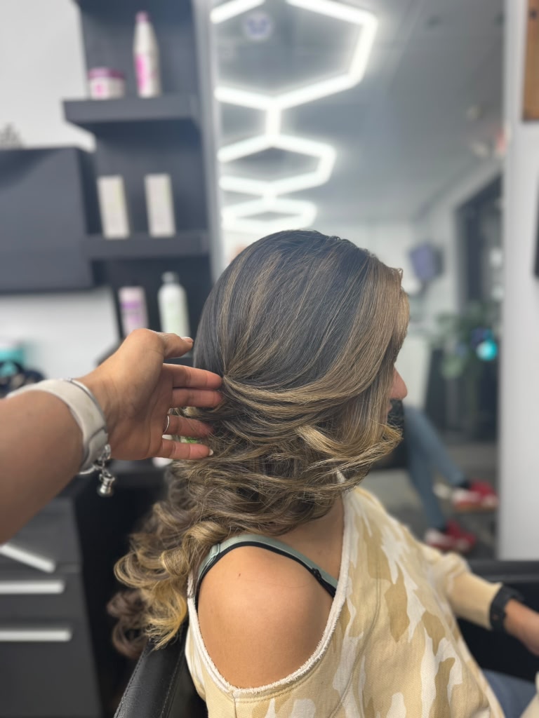 Stylist working on color and styling — Salon Melisa